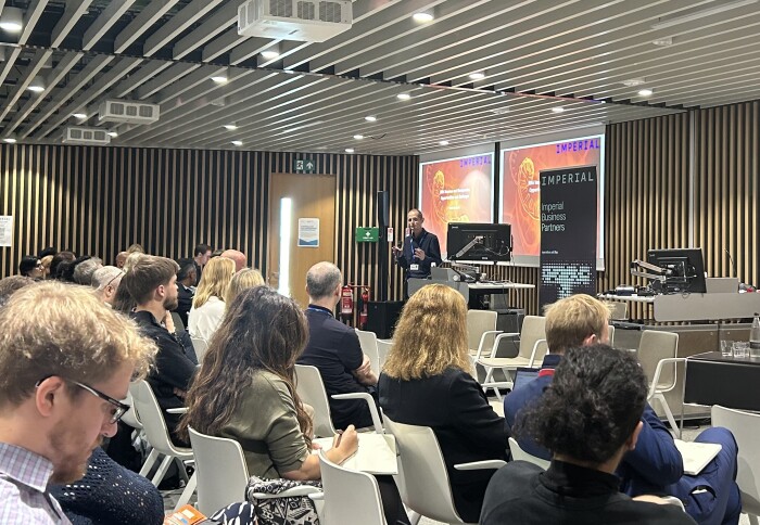 Professor Robin Shattock explains his research in front of an audience at an Imperial Business Partners event