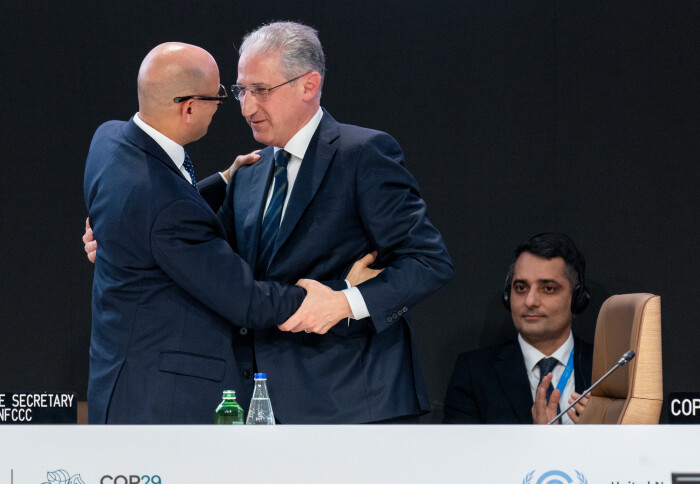 COP29 president Mukhtar Babayev and Executive Secretary of the UNFCC Simon Stiell embracing on stage at COP29 on Sunday.