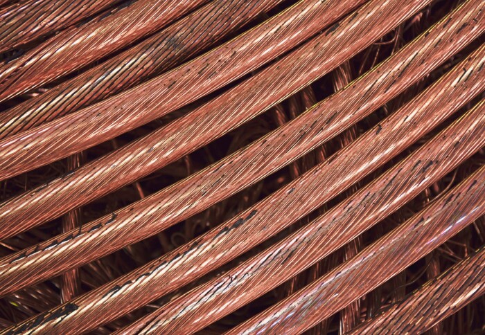 Close up copper wire scrap metal for recycling or reproducing in a melting foundry.