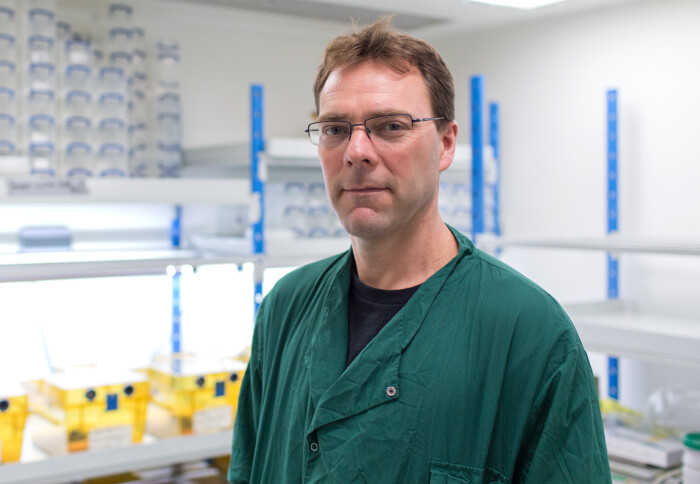 Professor Matthew Fisher stood in his laboratory at Imperial College London