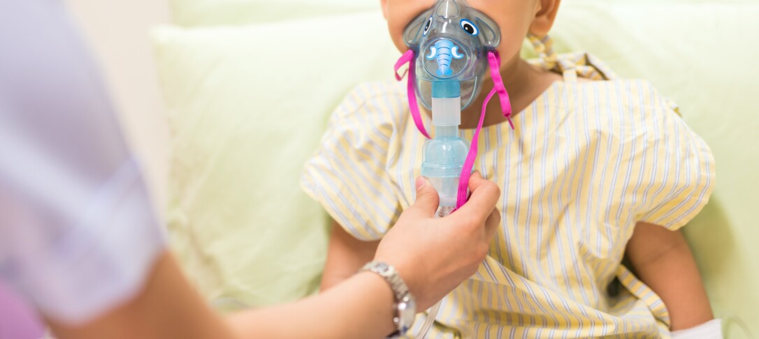 Child with respiratory mask