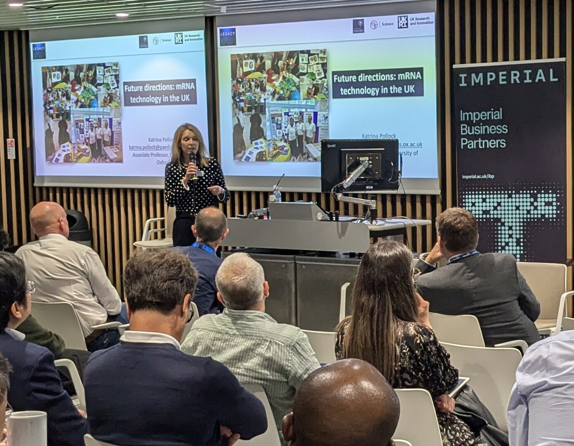 Dr Katrina Pollock talks in front of audience at event at Imperial College London