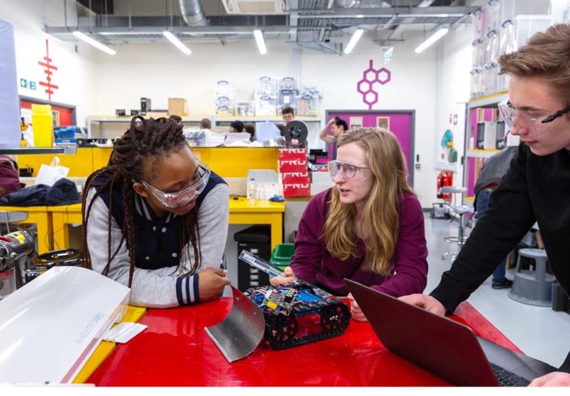 Three students working on a project in Imperial College Advanced Hackspace