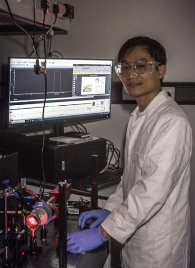 Photo of Caiwu Liang working in the laboratory.