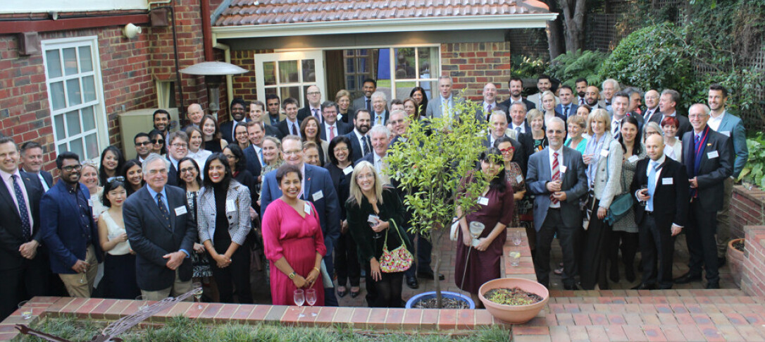 A large crowd of alumni gathered for a past meet up in Melbourne, which looks like it may have been hosted at someone's home