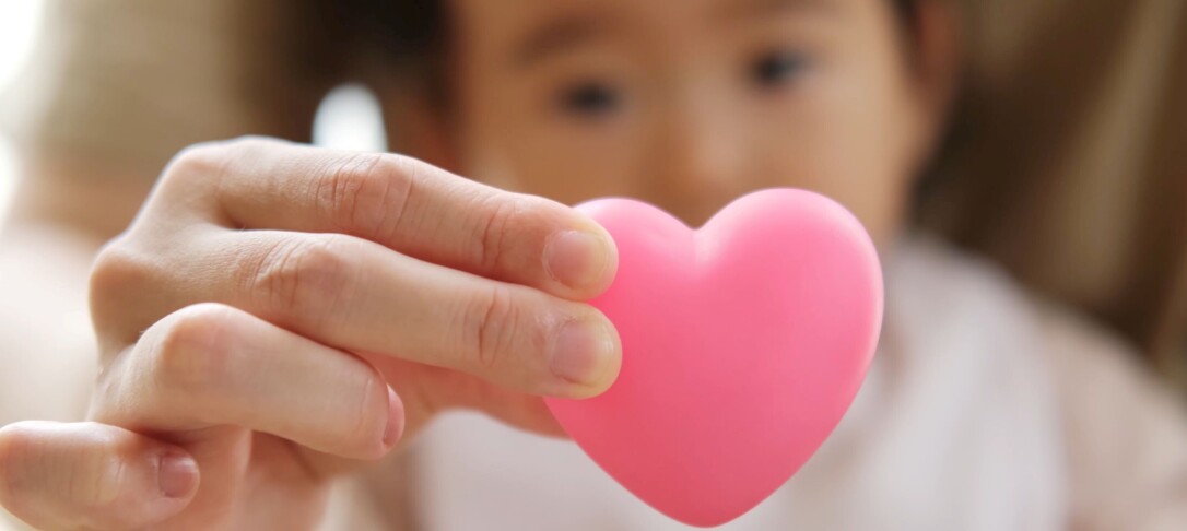 Child and pink heart