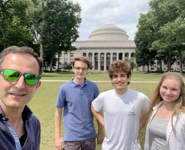 Alanna Senior posing for a photograph at MIT, with fellow students and Professor Arash Mostofi 