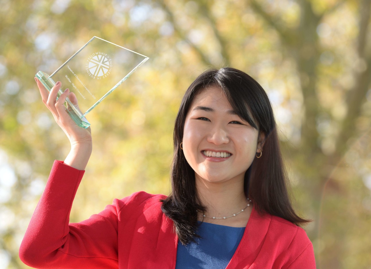 Innovation Design Engineering student WuQing Hipsh holding her award