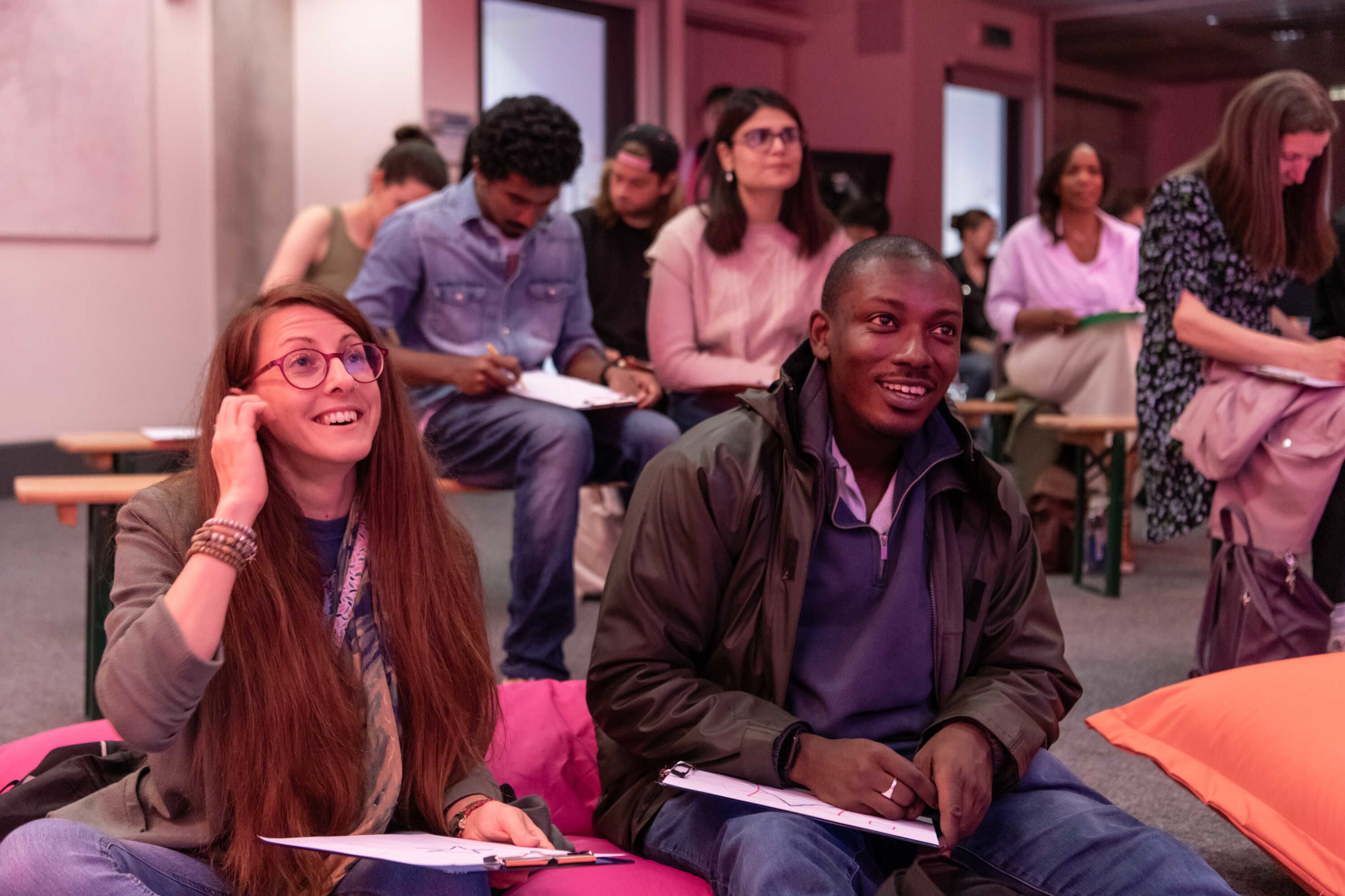 A man and a woman engaging with a quiz at Imperial Lates