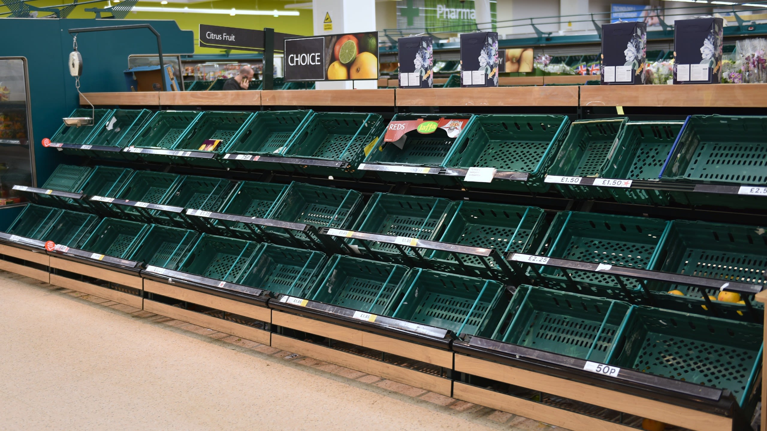 An image of an empty fruit and vegetable section of a UK supermarket during the COVID-19 pandemic.