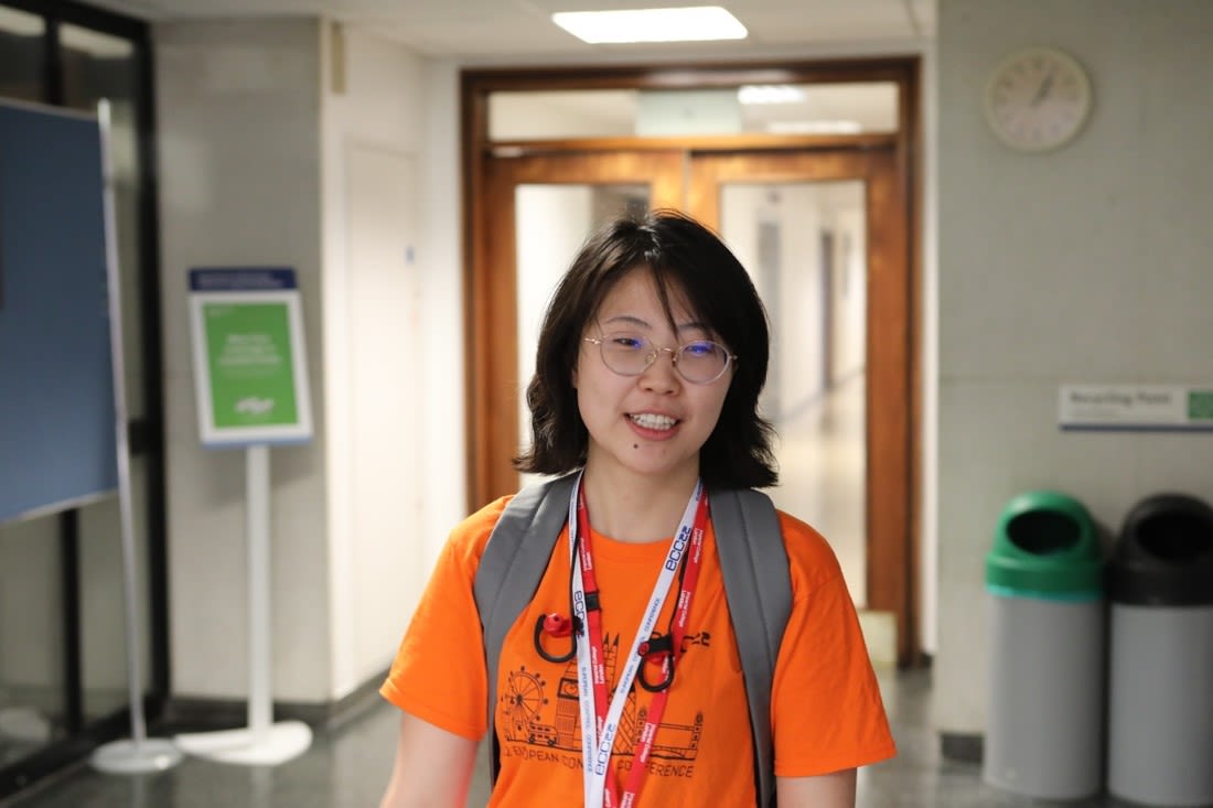 Image of Tianyi wearing an orange t-shirt