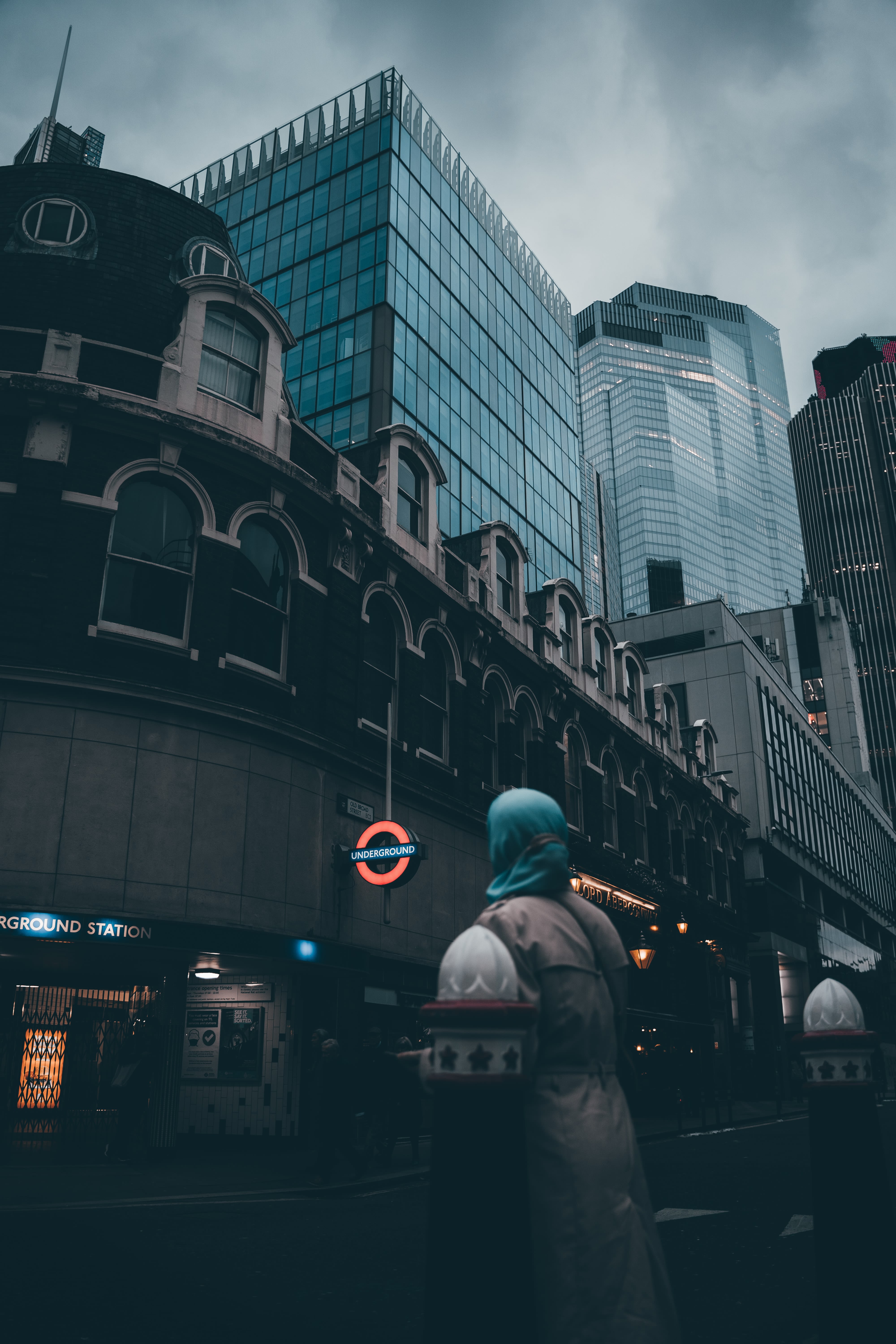 Picture of women walking past a London tube sign