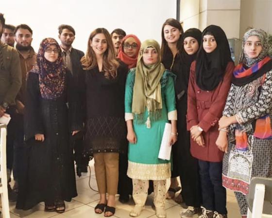 Alumnus Alizeh Atif stood with some of her students