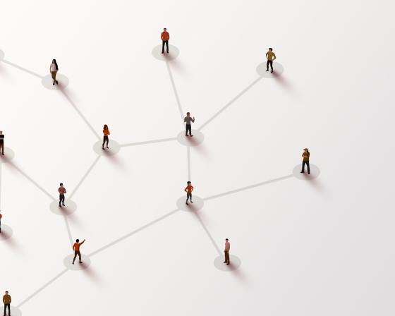 Birdseye view of people standing far apart with lines connecting them in a network