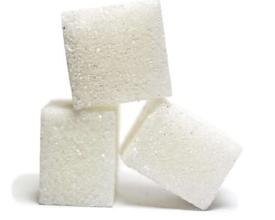 Three sugar cubes stacked on top of each other