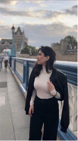 Saina stands on London Tower Bridge