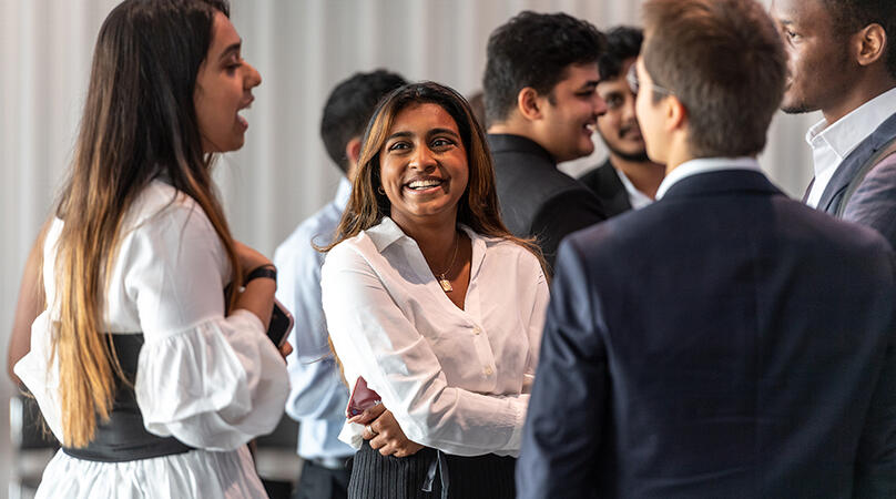 Students networking at an event 