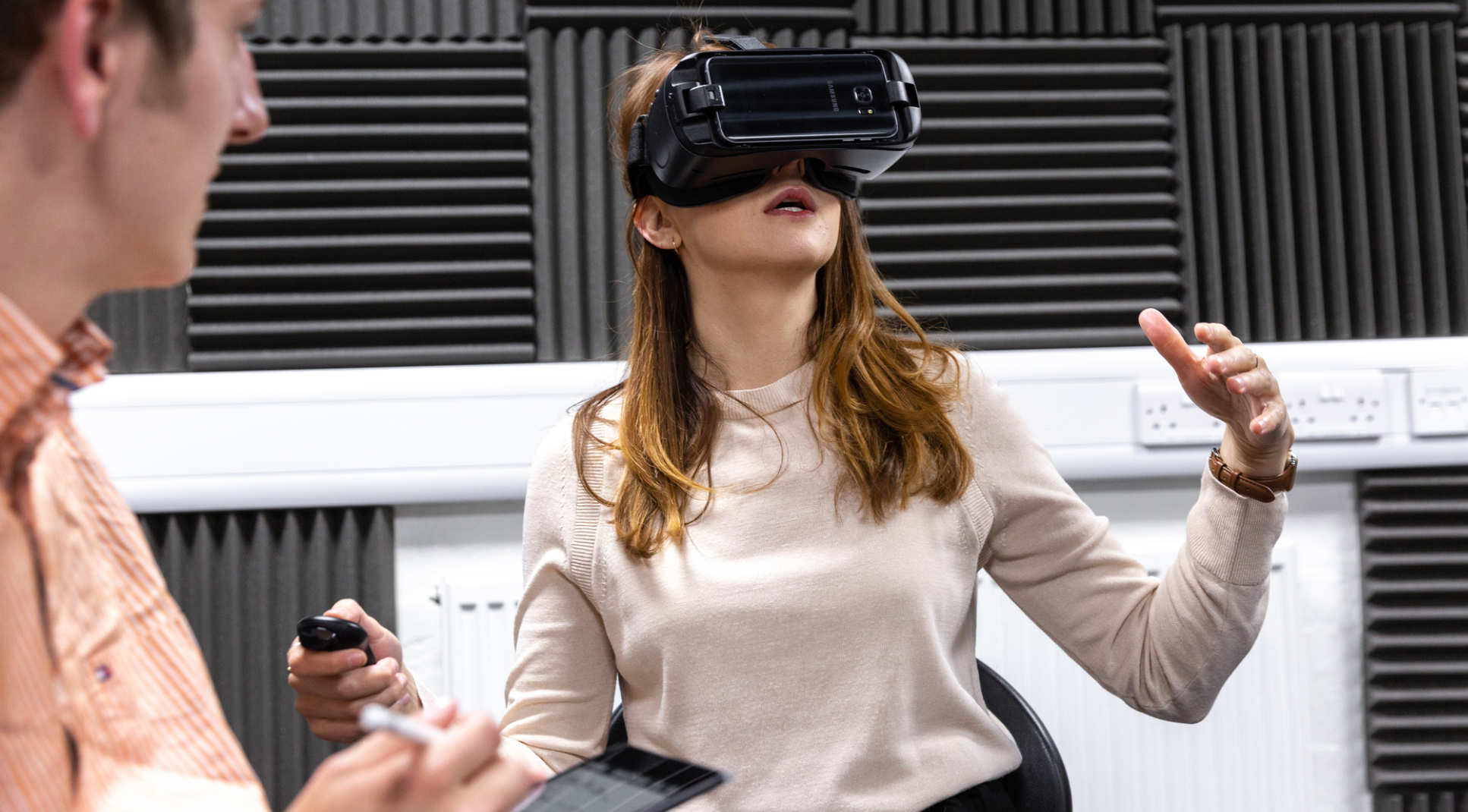 Dr Nejra Van Zalk uses virtual reality equipment with PhD student Ian Chard