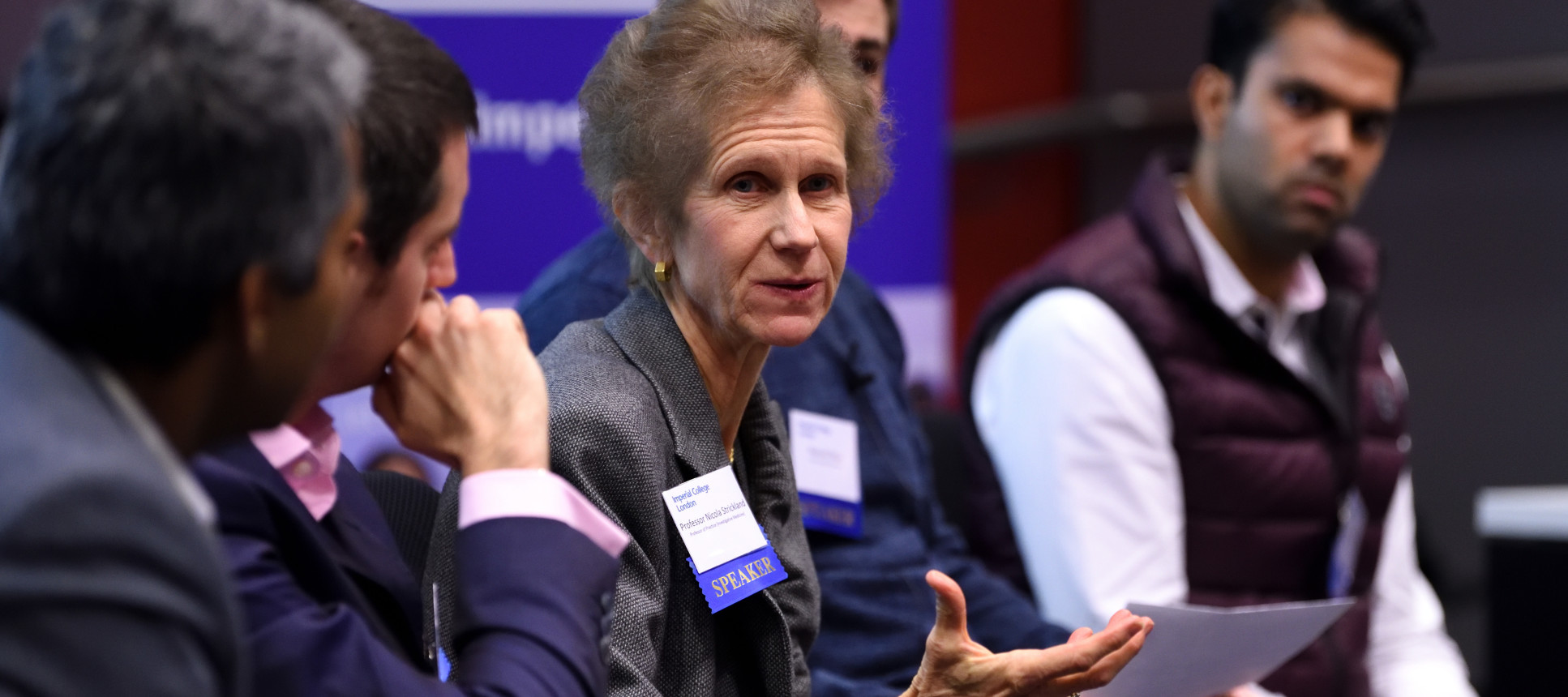 A panel of five speakers at a healthcare network event