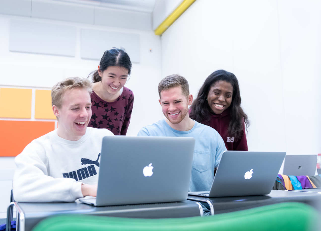 Applied Computational Science and Engineering MSc students working together on laptops