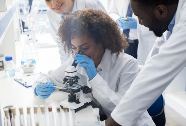 Students looking through a microscope