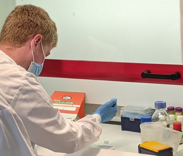 student using a pipette