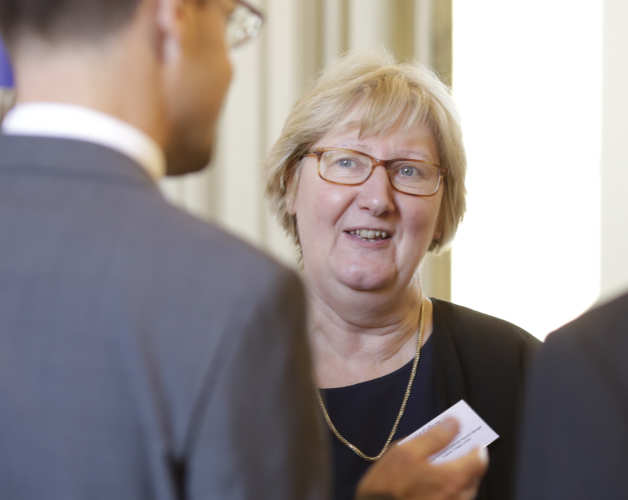 Guests in conversation at a legacy information event
