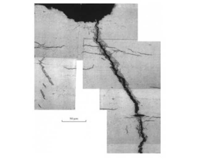 Figure 1: A crack that has propagated through zirconium fuel cladding, surrounded by hydride. Reproduced from [6]