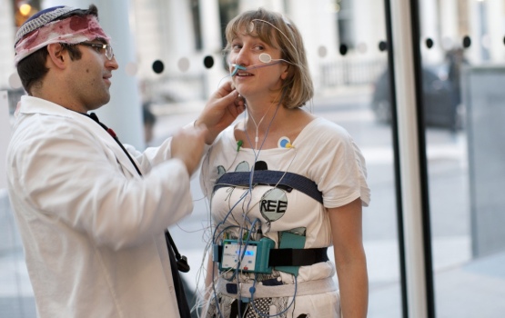 Wearing a wire: "Sleep researcher Martin Glasser wires me up with sensors. Yes, that is a bloody bandage under his yarmulke."