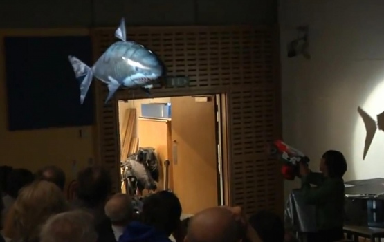 Zachary Blunden-Codd fends off an inflatable shark to explain the principles of laser cooling