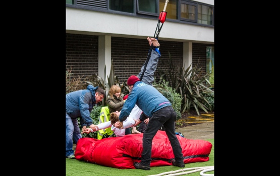 Jump organisers ensure a smooth landing, guiding relieved jumpers back to dry land