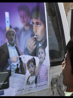 A Yemeni boy looks at a poster that shows an anti-schistosomiasis campaign at a school in Bait Khairan, 30km north of Sanaa