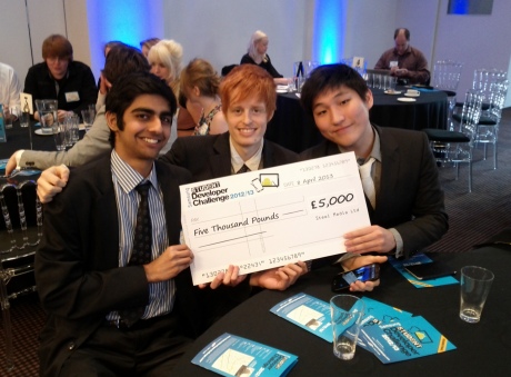 Rohan, Taehyun and Laim hold up their winners cheque