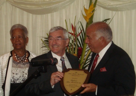 Professor Fenwick receiving his award at the House of Lords from Charles Modica (President of St George's University) and Baroness Howells.