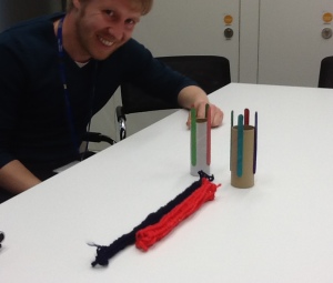 Dr Neil Dufton with knitted blood vessels