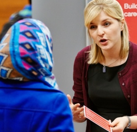 A student and employer engaging at a Careers Fair.