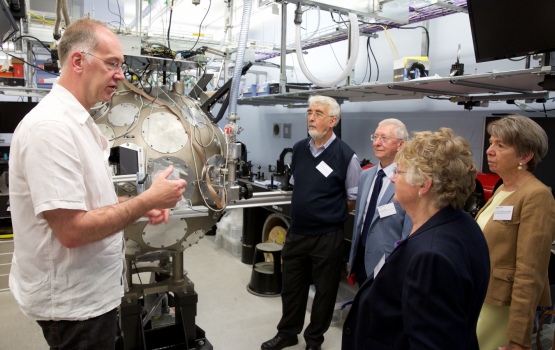 Professor Roland Smith proudly showing off a laser target chamber