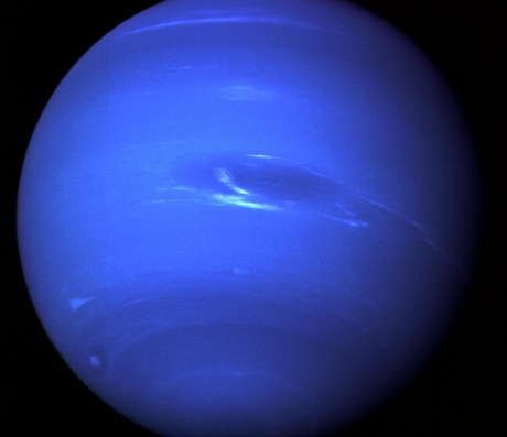 Planet Neptune, shrouded in blue swirly clouds