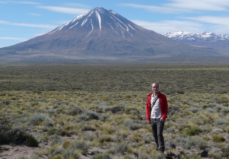 Craig Magee stands before Payun volcano, Argentina  