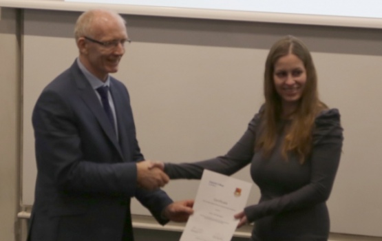 Lisa Kleiminger receives her award from Professor Andrew Livingston