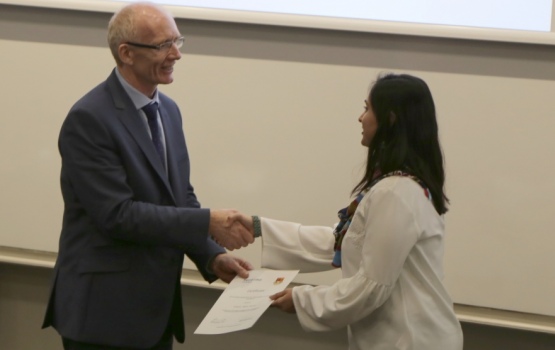 Aiman Alam Nazki receives her award from Professor Andrew Livingston