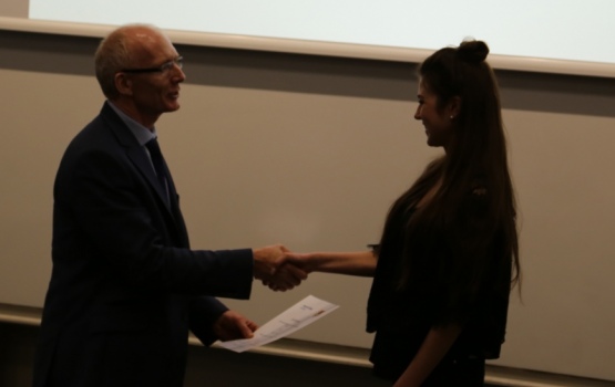 Chiara Heide receives her award from Professor Andrew Livingston