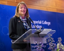 woman talking at lectern