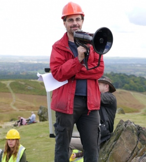 Dr mark Sutton with megaphone on a field trip