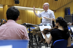 Conductor Richard Dickins leading rehersals for last week's Summer Concert