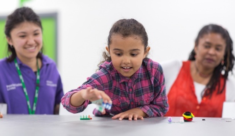 A young girl plays in the Imperial Makerspace