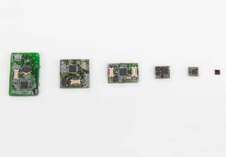 Image showing size of microchips from large to small, to demonstrate the evolution of making sensor chips more compact