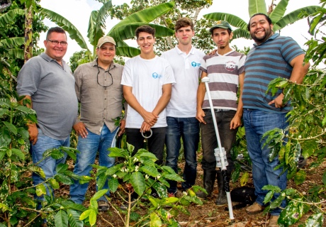 James and Paul with coffee farmers 