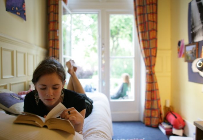 Student reading in halls