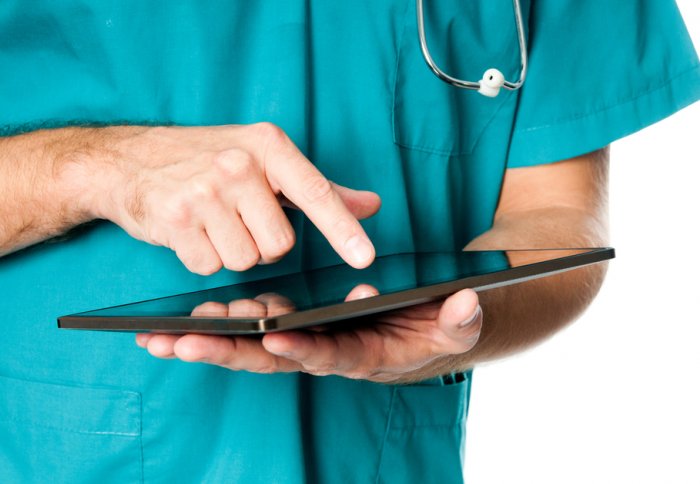 Doctor using a tablet computer